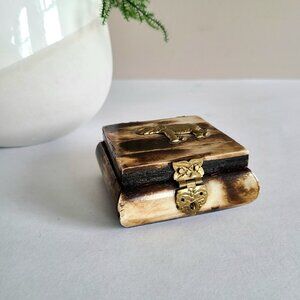 Vintage bone jewelry/trinket box with brass elephant.